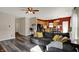 Spacious living room featuring a gray couch, wood-look floors, and natural light at 4051 Presidio Cir, Indianapolis, IN 46235