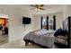 Bright main bedroom featuring a mounted TV and access to the kitchen at 4051 Presidio Cir, Indianapolis, IN 46235