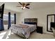 Spacious primary bedroom features a ceiling fan and natural light from a window at 4051 Presidio Cir, Indianapolis, IN 46235