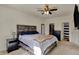 Comfortable main bedroom with a large bed, ceiling fan, and neutral decor at 4051 Presidio Cir, Indianapolis, IN 46235