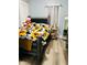 Bedroom with trendy sunflower bedding, a gray wood frame and flooring, ready for a homeowner's touch at 428 N Alton Ave, Indianapolis, IN 46222