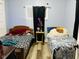 Small bedroom with two twin beds and a black-out curtain, ready for a makeover at 428 N Alton Ave, Indianapolis, IN 46222