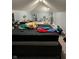 A bedroom in disarray shows the potential for a remodel to bring renewed value to this space at 428 N Alton Ave, Indianapolis, IN 46222