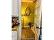 Bright hallway with wood-look flooring, a decorative lamp, and a glimpse into the adjacent room at 428 N Alton Ave, Indianapolis, IN 46222