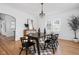 Bright dining room featuring hardwood floors and elegant chandelier at 4310 Central Ave, Indianapolis, IN 46205