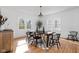 Spacious dining room with hardwood floors and many windows providing natural light at 4310 Central Ave, Indianapolis, IN 46205