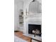 Elegant fireplace with white mantel, marble surround, and built-in shelving providing a cozy focal point at 4310 Central Ave, Indianapolis, IN 46205
