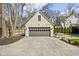 Garage with driveway in front of the home with neutral paint and gray doors at 4310 Central Ave, Indianapolis, IN 46205