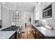 Modern kitchen with granite countertops, stainless appliances and pantry at 4310 Central Ave, Indianapolis, IN 46205