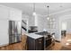 Bright kitchen with stainless appliances, eat at bar and gas range at 4310 Central Ave, Indianapolis, IN 46205