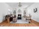 Bright, classically decorated living room features hardwood floors, a fireplace, and plentiful natural light at 4310 Central Ave, Indianapolis, IN 46205