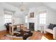Bright home office with hardwood floors, fireplace, two windows, and a comfortable leather chair at 4310 Central Ave, Indianapolis, IN 46205