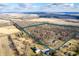A scenic aerial view showcasing a spacious property with a mix of trees and open land at 4543 E 700 N, Alexandria, IN 46001