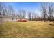Sprawling backyard featuring large lawn and home with access to back deck at 4543 E 700 N, Alexandria, IN 46001