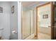En suite bathroom featuring glass shower stall with adjacent soaking tub at 4543 E 700 N, Alexandria, IN 46001