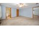 Large bedroom featuring ample space, a ceiling fan, and doors leading to other areas of the home at 4543 E 700 N, Alexandria, IN 46001
