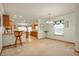 Eat-in kitchen with wood cabinetry and views into the dining room at 4543 E 700 N, Alexandria, IN 46001