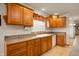 Close-up of a kitchen sink with wooden cabinets, showcasing style and functionality in a cozy space at 4543 E 700 N, Alexandria, IN 46001