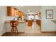 Inviting kitchen with wooden cabinetry, central island, and an adjacent dining area, all bathed in natural light at 4543 E 700 N, Alexandria, IN 46001