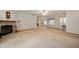 Large living room with a fireplace, neutral carpet, and an open floor plan at 4543 E 700 N, Alexandria, IN 46001