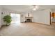 Spacious living room with a fireplace, neutral carpet, and sliding glass doors at 4543 E 700 N, Alexandria, IN 46001