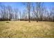 A wide grassy field with a utility shed and various trees at 4543 E 700 N, Alexandria, IN 46001