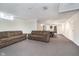 Finished basement area with neutral carpet, couches, and a pool table in the background at 4905 N Dearborn St, Indianapolis, IN 46205