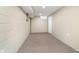 Unfurnished basement area with neutral carpet providing ample storage or customization options at 4905 N Dearborn St, Indianapolis, IN 46205