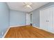 Bedroom featuring hardwood floors, a ceiling fan and a closet at 4905 N Dearborn St, Indianapolis, IN 46205
