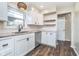 Bright kitchen with updated countertops, stainless steel dishwasher and white cabinets at 4905 N Dearborn St, Indianapolis, IN 46205