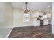 Modern kitchen and dining area with stainless steel appliances and hardwood floors at 4905 N Dearborn St, Indianapolis, IN 46205