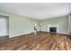 Spacious living room with hardwood floors and a fireplace, perfect for relaxation at 4905 N Dearborn St, Indianapolis, IN 46205
