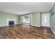 Inviting living room with hardwood floors, a fireplace, and ample natural light at 4905 N Dearborn St, Indianapolis, IN 46205