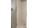 Shower with white tiling, complemented by a frosted glass shower door and white base at 540 Louise Dr, Indianapolis, IN 46217