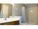 Bathroom with vanity, sink, and tub with shower and shower curtain at 540 Louise Dr, Indianapolis, IN 46217