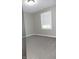 Bedroom featuring neutral walls, carpeted floors, and natural light from a window at 540 Louise Dr, Indianapolis, IN 46217