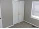Bedroom featuring neutral walls, carpeted floors, and a large closet with mirrored doors at 540 Louise Dr, Indianapolis, IN 46217