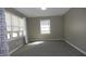 Bright bedroom with neutral walls, carpet flooring, and windows at 540 Louise Dr, Indianapolis, IN 46217