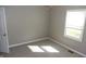 Cozy bedroom with neutral walls and carpet, offering natural light through the window at 540 Louise Dr, Indianapolis, IN 46217