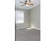 Bedroom features neutral walls, carpeted floors, a ceiling fan, and natural light at 540 Louise Dr, Indianapolis, IN 46217