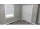 Bedroom featuring neutral walls, carpeted floors, and a closet with mirrored doors at 540 Louise Dr, Indianapolis, IN 46217