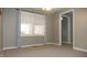 Bedroom featuring neutral walls, carpeted floors, and a window with drapes at 540 Louise Dr, Indianapolis, IN 46217