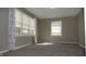 Bedroom featuring neutral walls, carpet flooring, and bright windows at 540 Louise Dr, Indianapolis, IN 46217
