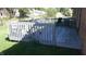Spacious wood deck overlooking the backyard, complete with patio table and chairs at 540 Louise Dr, Indianapolis, IN 46217