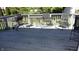 Spacious wood deck with a grill, dining table and chairs overlooking the yard at 540 Louise Dr, Indianapolis, IN 46217