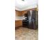 Modern kitchen with stainless steel appliances and luxury vinyl flooring at 540 Louise Dr, Indianapolis, IN 46217