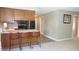 Kitchen with breakfast bar seating and stainless steel appliances at 540 Louise Dr, Indianapolis, IN 46217