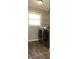 Laundry room featuring a window, tile flooring, wire shelving, and newer washer dryer at 540 Louise Dr, Indianapolis, IN 46217