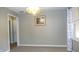 Bright living room showcasing neutral walls, plush carpeting, and a decorative light fixture at 540 Louise Dr, Indianapolis, IN 46217