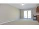 Bright living room featuring new carpet and sliding glass doors to the outside at 540 Louise Dr, Indianapolis, IN 46217